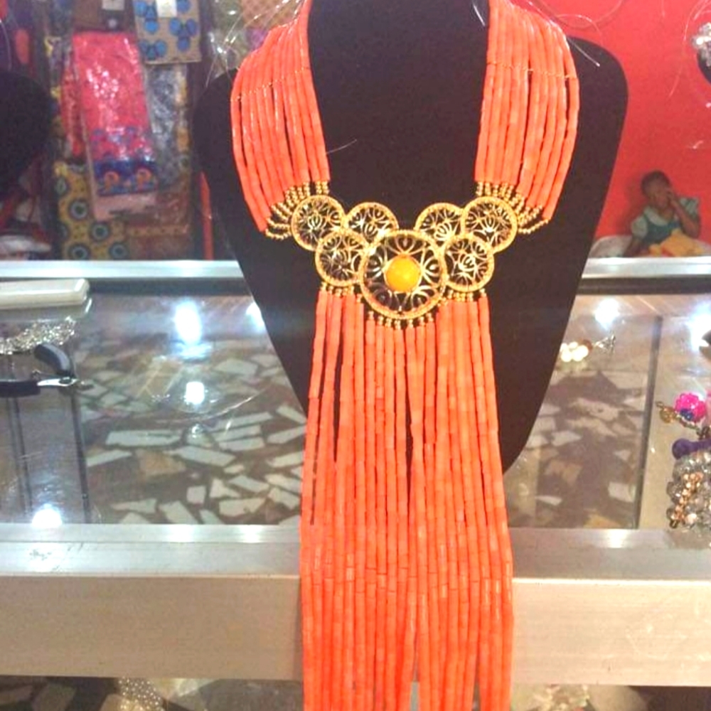 Hand made coral bead set with a gold pendant